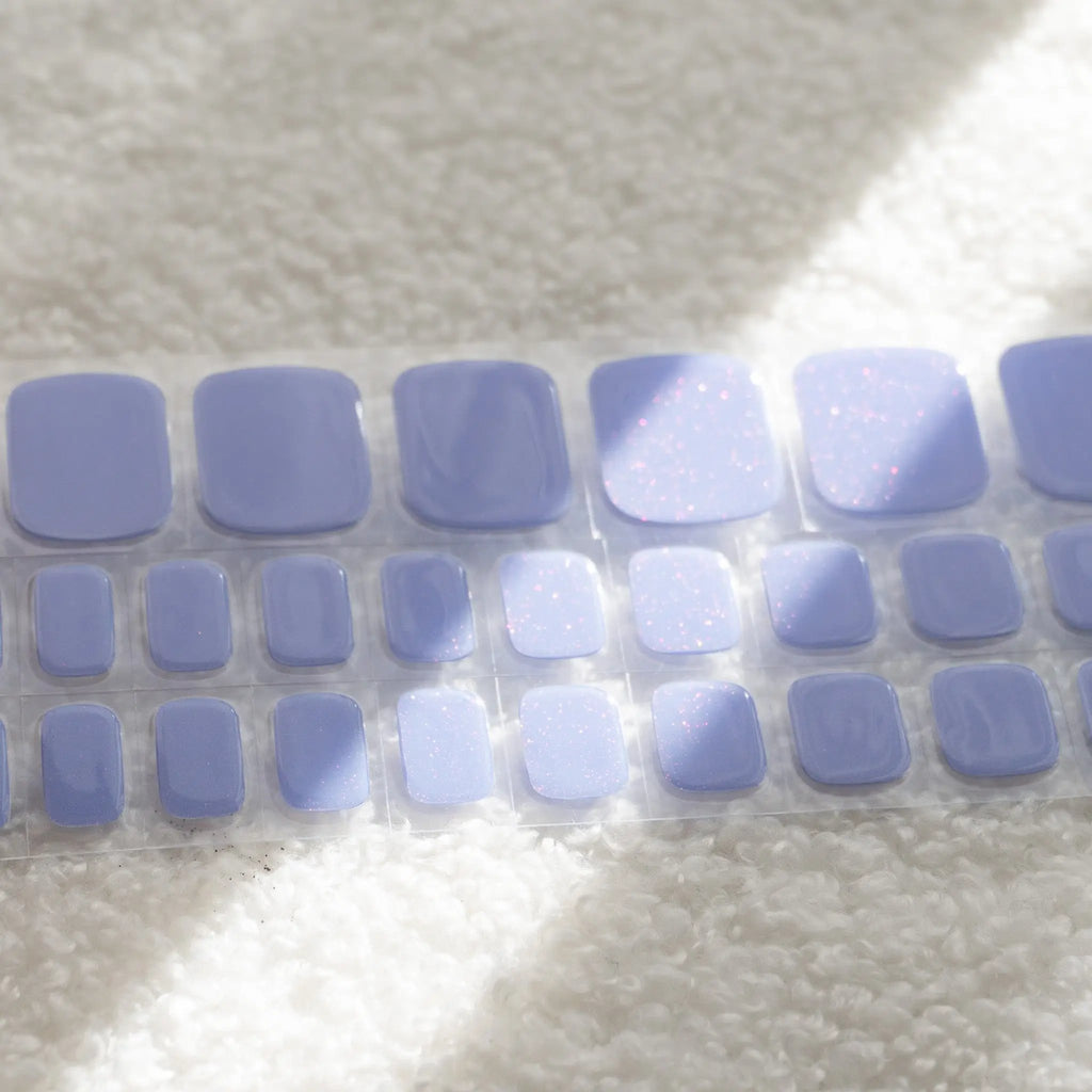 Elevate your pedicure game with our shimmery light blue Semicured DIY Gel Nail Sticker. Achieve a stunning and long-lasting look.